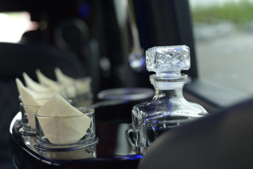 Image of glasses inside of car on American Limousines website